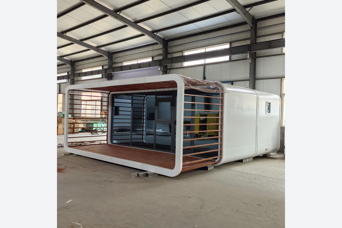 factory-built 20ft Apple Cabin with white ACP shell and wood-look veranda