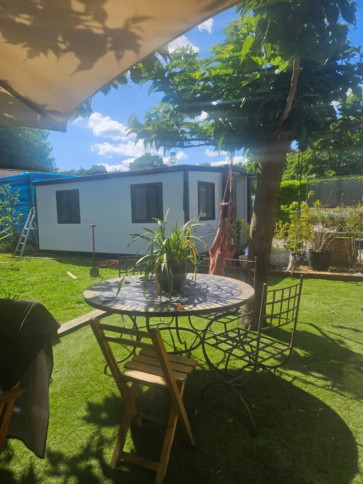 completed 20ft expandable container house installed in a private garden in France