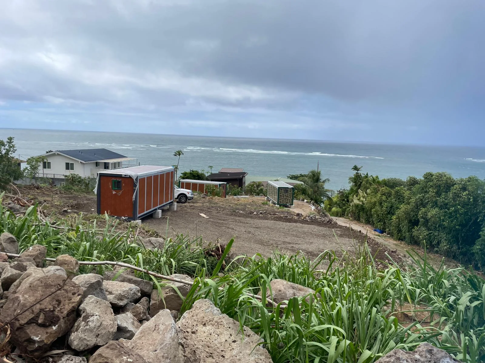 20ft expandable folding houses installed near the ocean in Guadeloupe