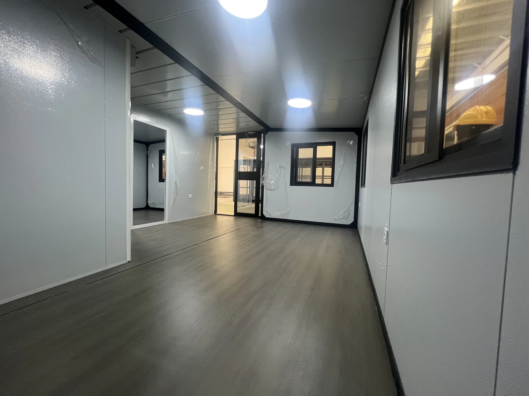 Interior quality check of a 20ft expandable house with lighting windows and finished flooring