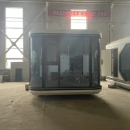 curved glass front facade of a 20ft prefab capsule house