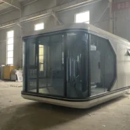 20ft white Apple Cabin space capsule pod with curved panoramic glass facade