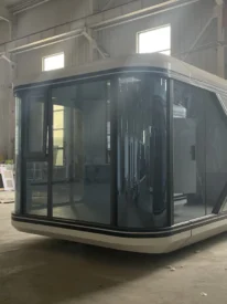 20ft white Apple Cabin space capsule pod with curved panoramic glass facade