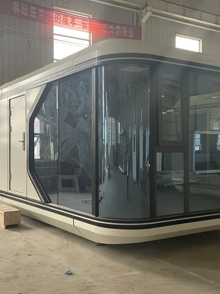 20ft Prefab Apple Pod Factory View factory-built 20ft Apple pod with rounded white shell and dark glass