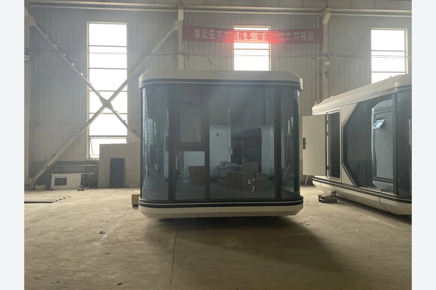 front view of a 20ft modular space capsule pod with floor-to-ceiling glass