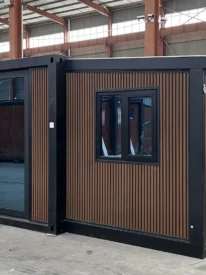20ft wood grain expandable container house with black frame and vertical fluted exterior cladding