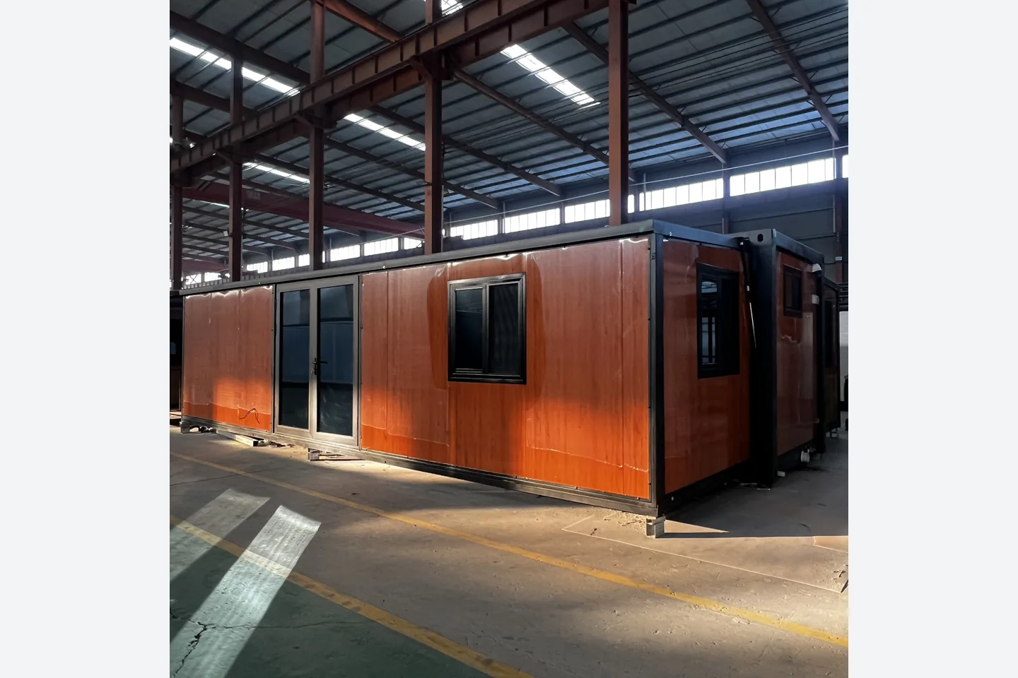 30ft red wood grain double wing expandable house with black frame