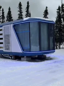 38 square meter white and blue Space Capsule House with panoramic glass installed at a snow resort