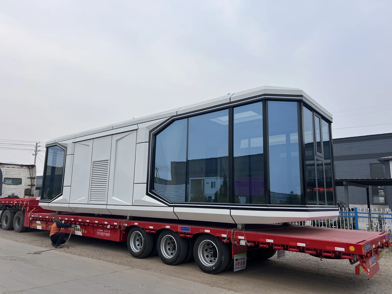 completed 38 square meter Space Capsule House loaded on a flatbed trailer