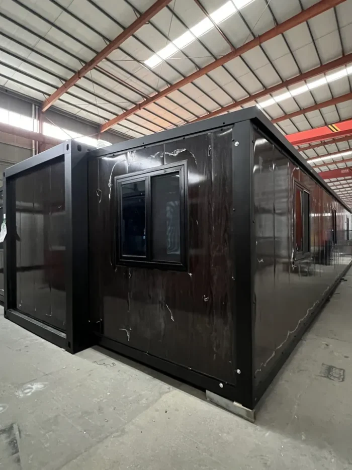 40ft Black Walnut Prefab Home - Rear View rear view of 40ft black walnut folding prefab home with black windows