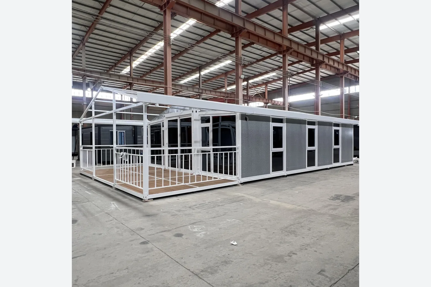 40ft gray expandable container house with white frame and front veranda
