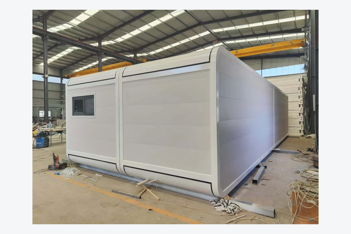 40ft white Apple Cabin with rounded exterior shell and thermal-break aluminum window