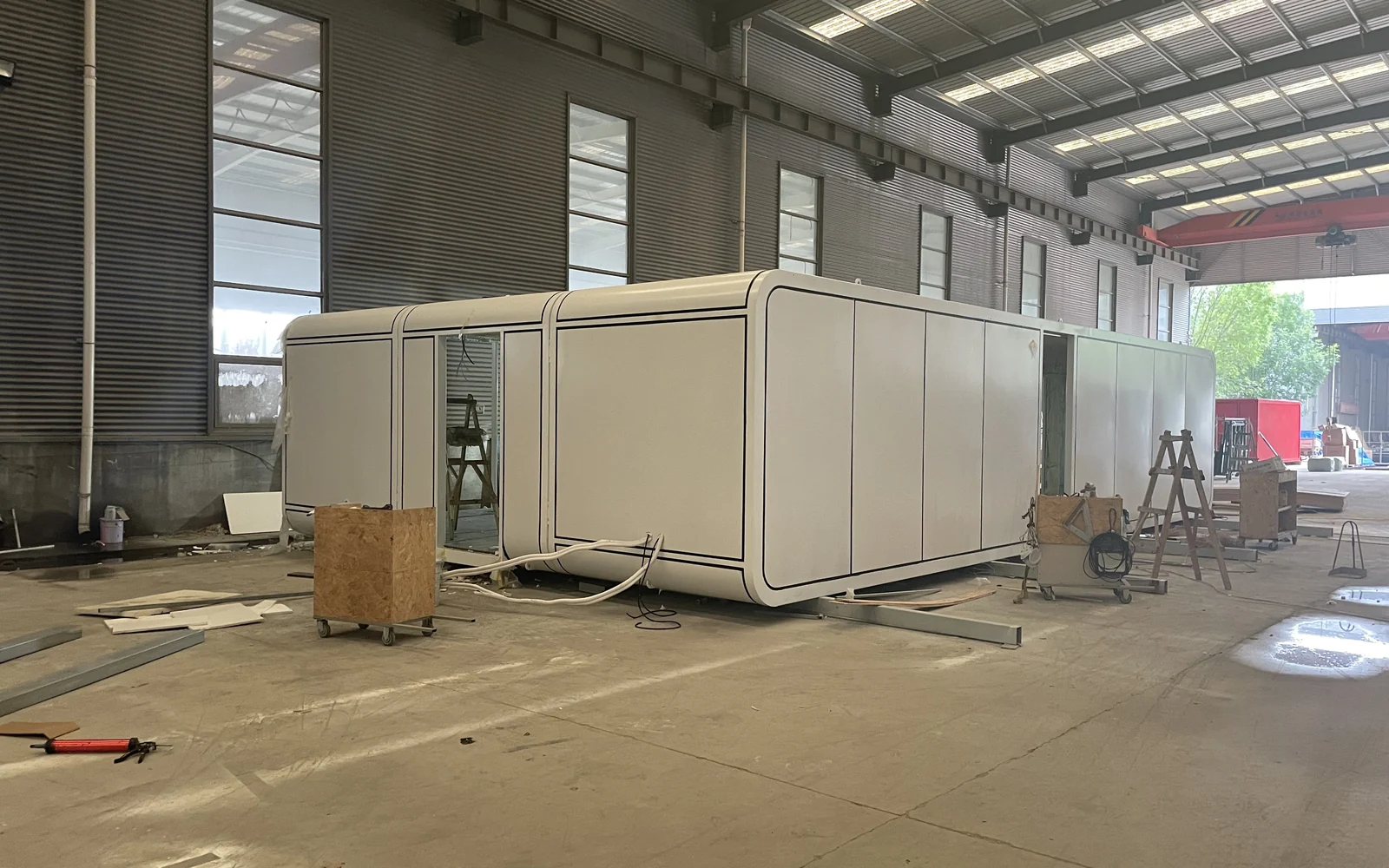 White Apple Cabin modular house under production in the factory