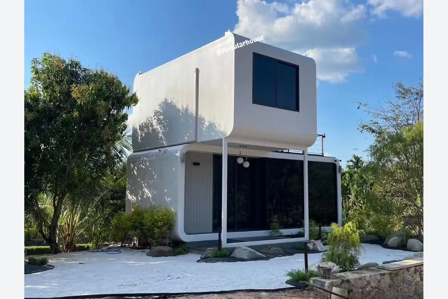 installed white double storey apple pod house with offset upper module