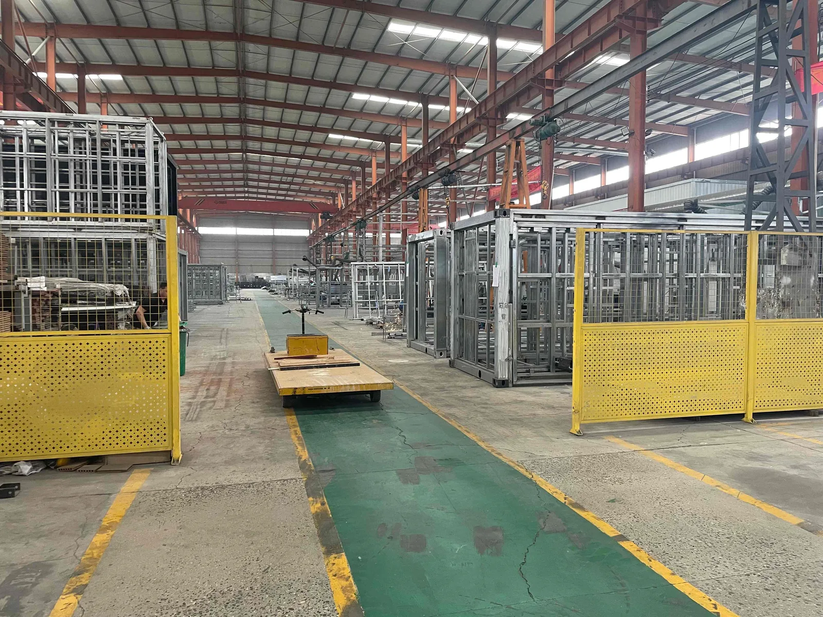 Expandable prefab house steel frame production line inside factory workshop