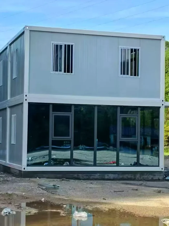 Glazed End View of Modular Container Building glazed end facade of a two-storey modular container office building in Indonesia