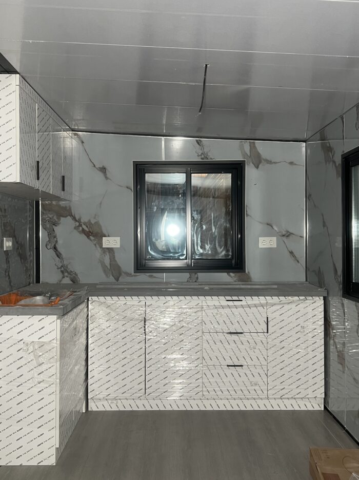 prefab-house-kitchen-factory-inspection Prefab house kitchen cabinets and windows during factory inspection