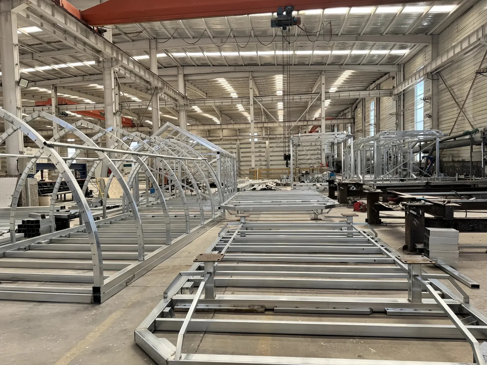 multiple steel frames for Space Capsule modular houses in a production workshop