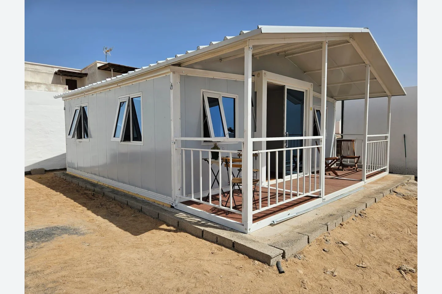 completed 20ft expandable prefab house with covered balcony installed for a customer in Spain