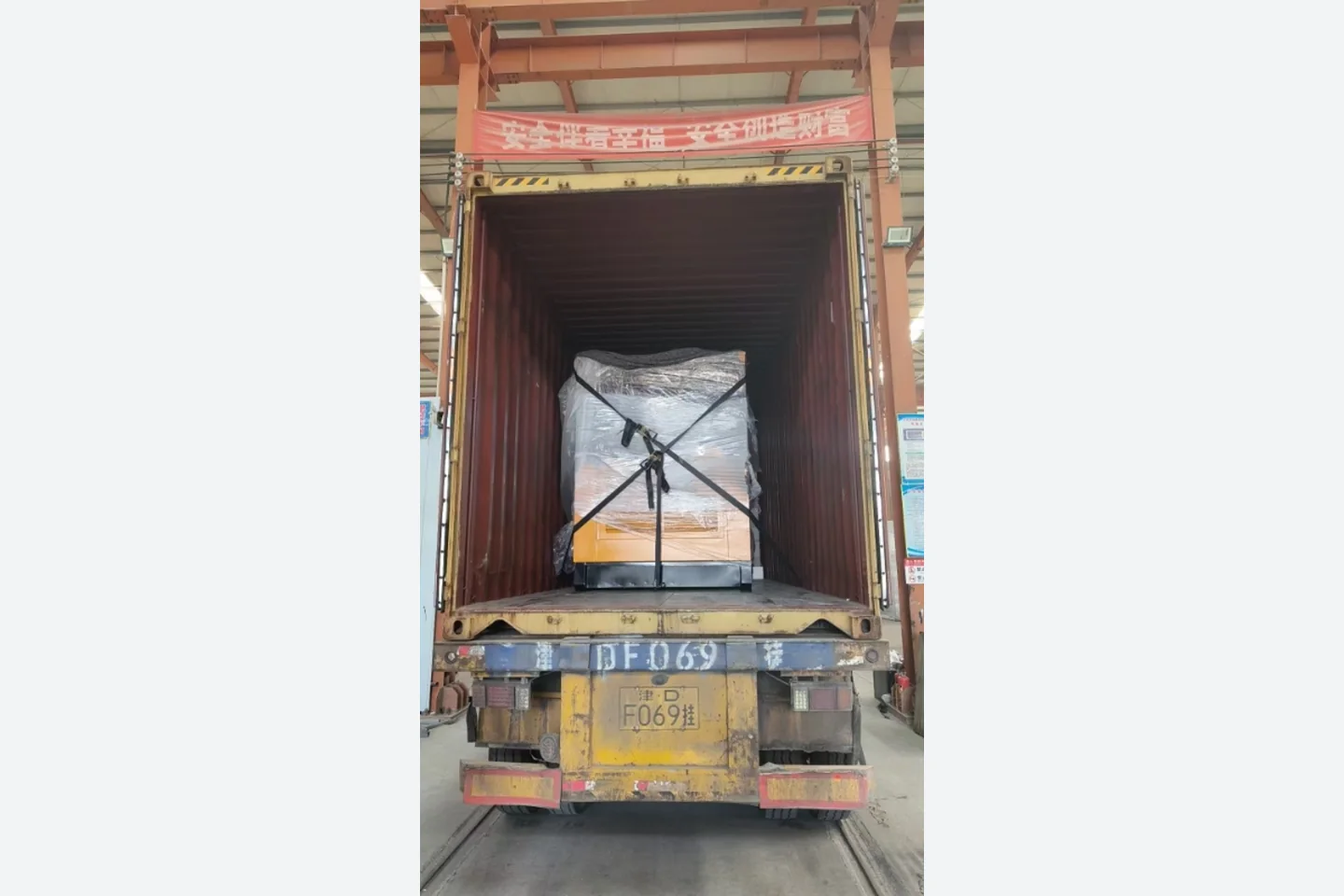 prefab house components secured inside a shipping container for Spain