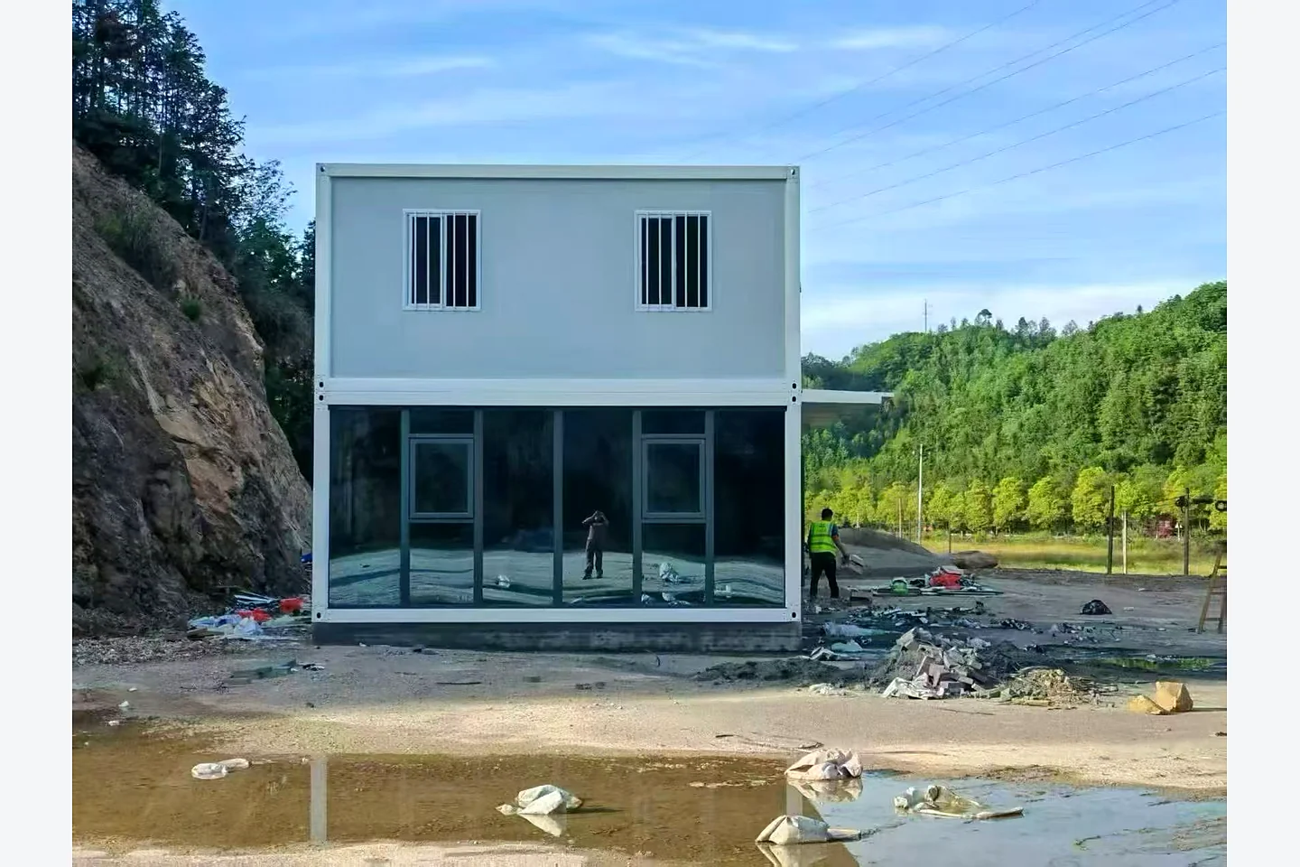 end elevation of a two-storey quick-assembly container house at a mountain site