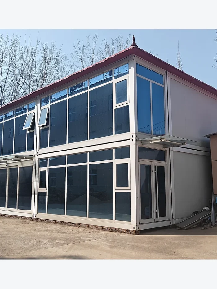 two-storey quick-assembly container building with glass facade for modular offices