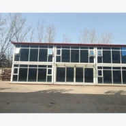 front view of a two-storey quick-assembly container building with multiple glass-fronted units