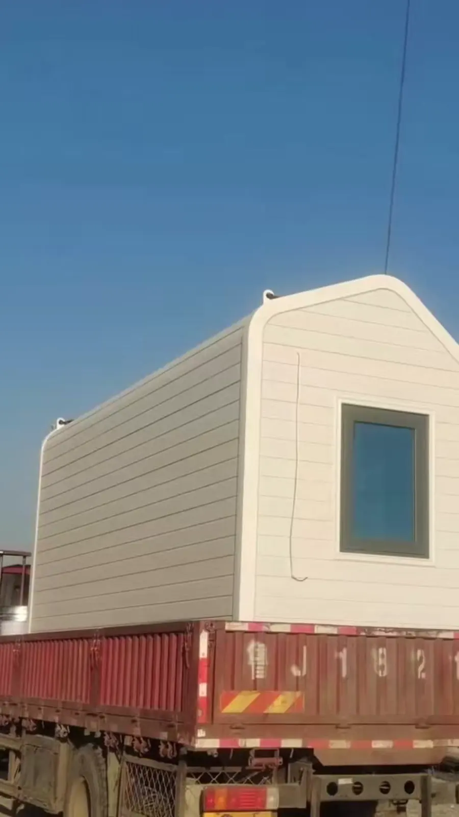Apple Cabin secured on transport container and ready for shipping