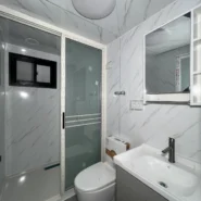 Bathroom with toilet washbasin and shower in a 20ft expandable house