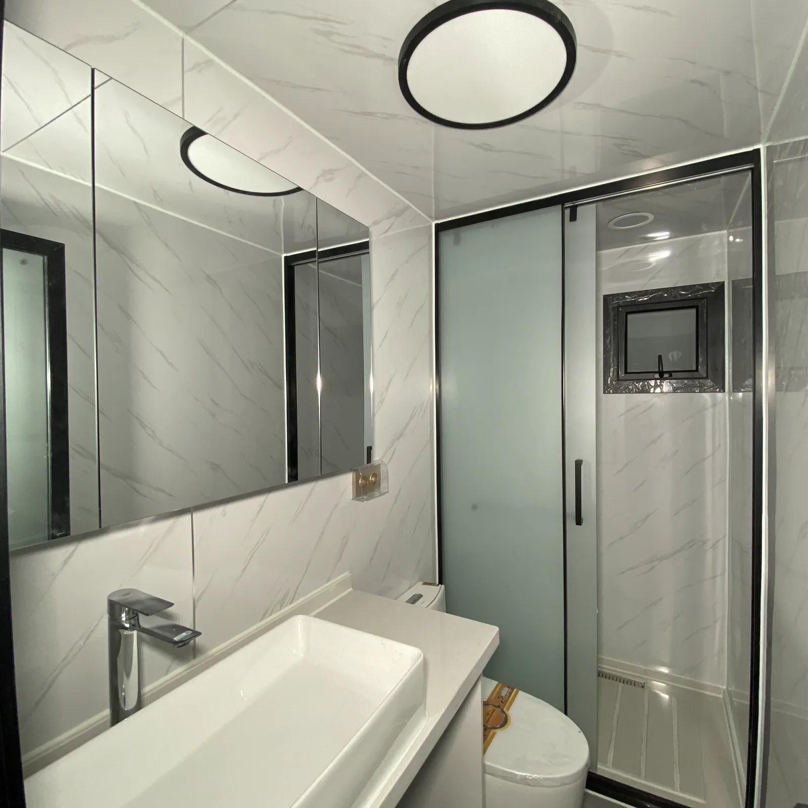 expandable container house bathroom with separate shower area