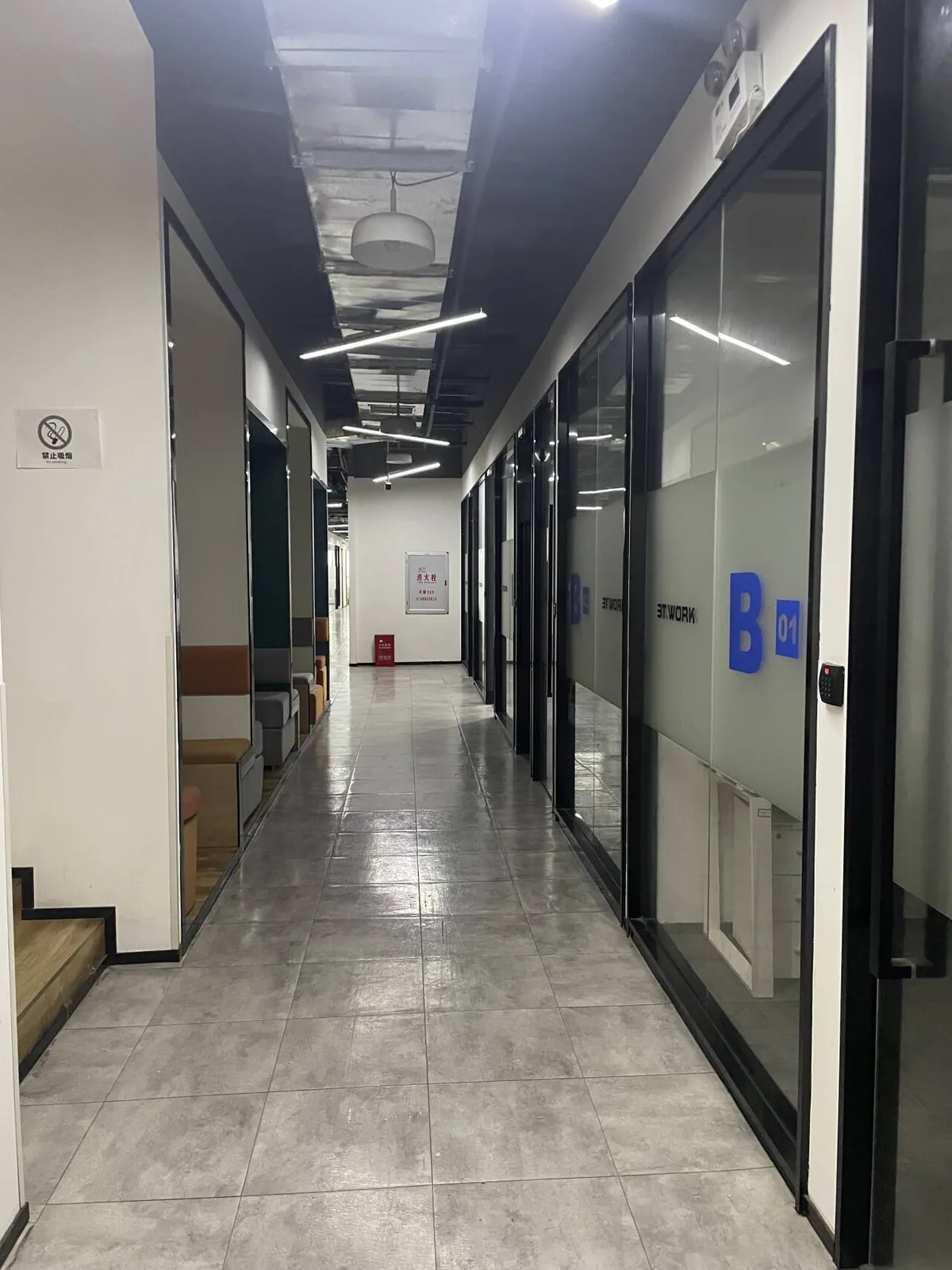 Glass-walled corridor connecting the Zhengzhou Vision office rooms