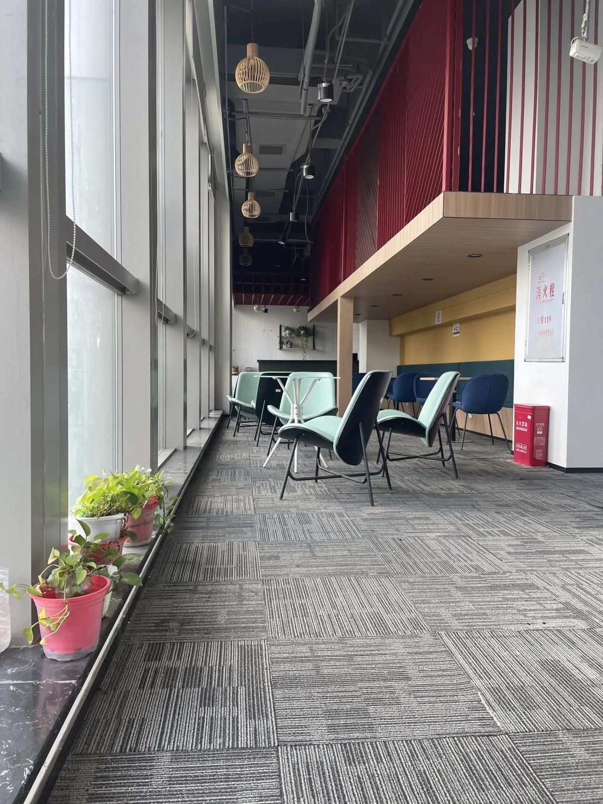 Bright office lounge and collaboration area beside panoramic windows
